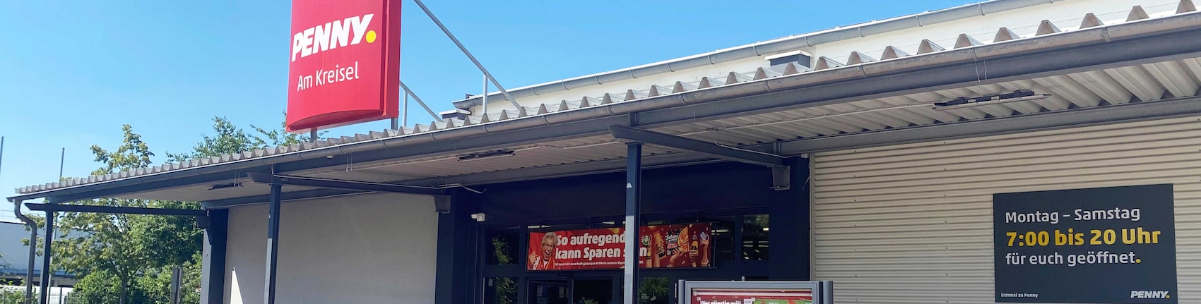 Sie sehen den Eingang vom Penny Markt in Hallbergmoos, Lindberghstr. 7
