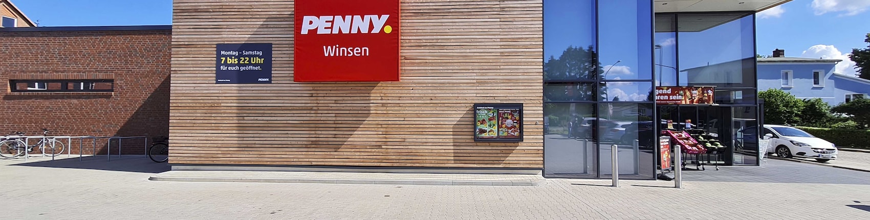 Sie sehen den Eingang vom Penny Markt in Winsen (Luhe), Lüneburger Straße 77
