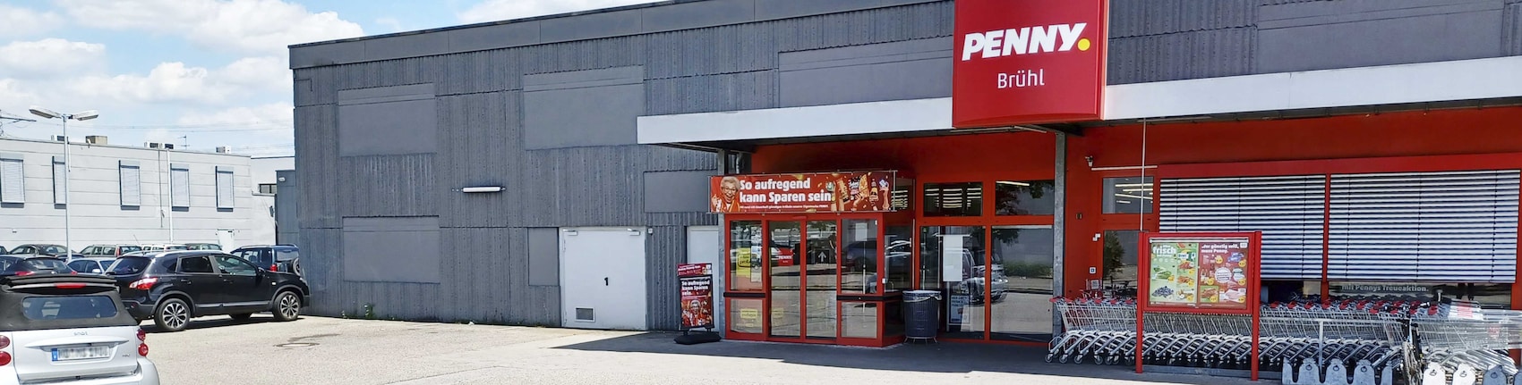 Sie sehen den Eingang vom Penny Markt in Brühl Albert-Bassermann-Str. 29