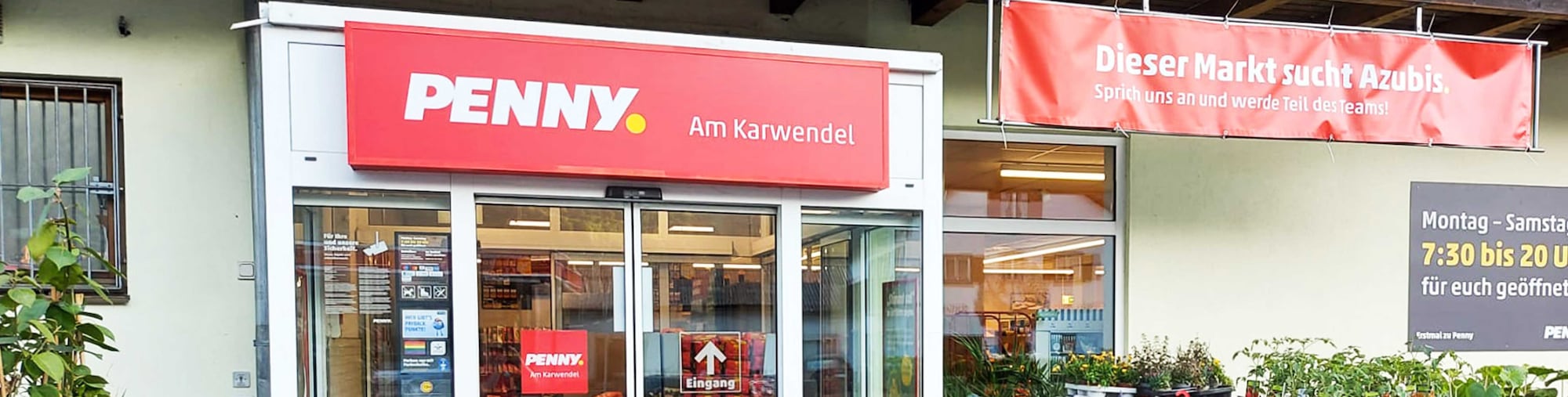 Sie sehen den Eingang vom Penny Markt in Mittenwald Partenkirchener Str. 53