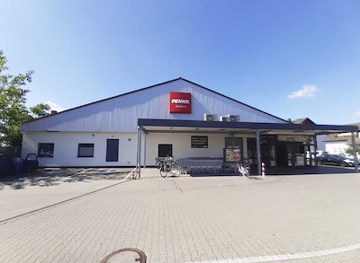 Sie sehen den Eingang vom Penny Markt in Mannheim/Feudenheim, Mohnaeckerstr. 1-5