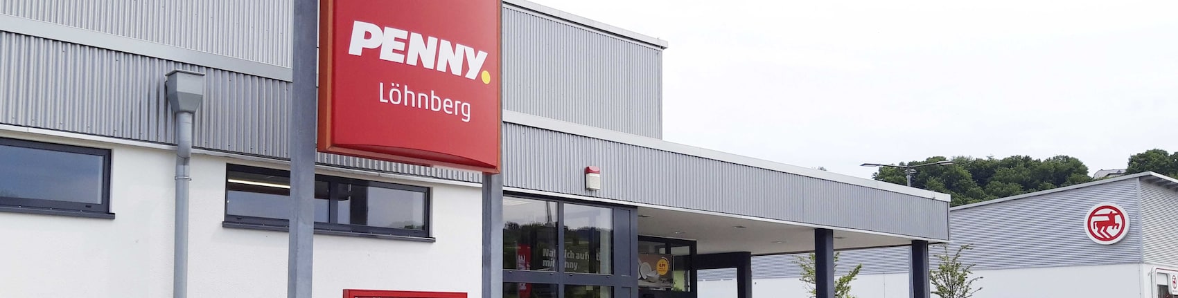 Sie sehen den Eingang vom Penny Markt in Löhnberg, L3281/Güldenstadt 1