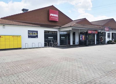 Sie sehen den Eingang vom Penny Markt in Luhden, Dorfstr. 1A