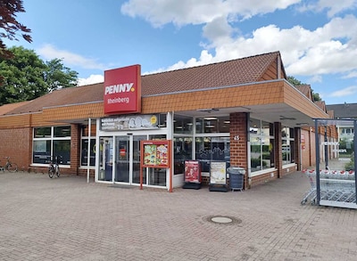 Sie sehen den Eingang vom Penny Markt Rheinberg Annastrasse 65