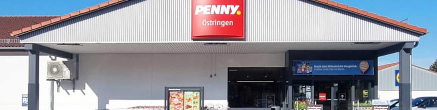 Sie sehen den Eingang vom Penny Markt in Oestringen, Thomas-Howie-Str. 17