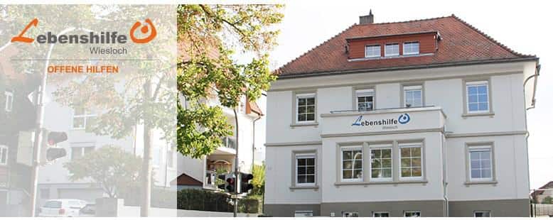 Vereinslogo mit dem Vereinsgebaeude im Hintergrund
