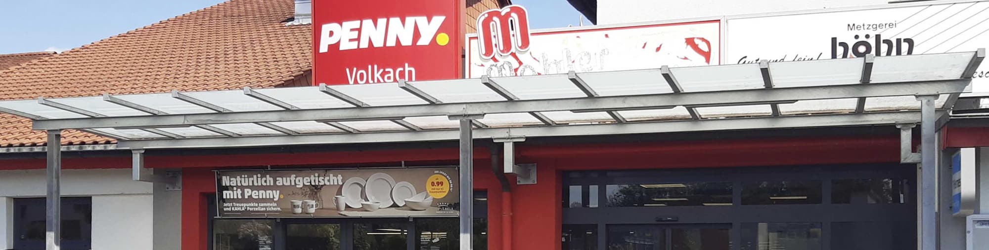 Sie sehen den Eingang vom Penny Markt in Volkach In der Röthe 4