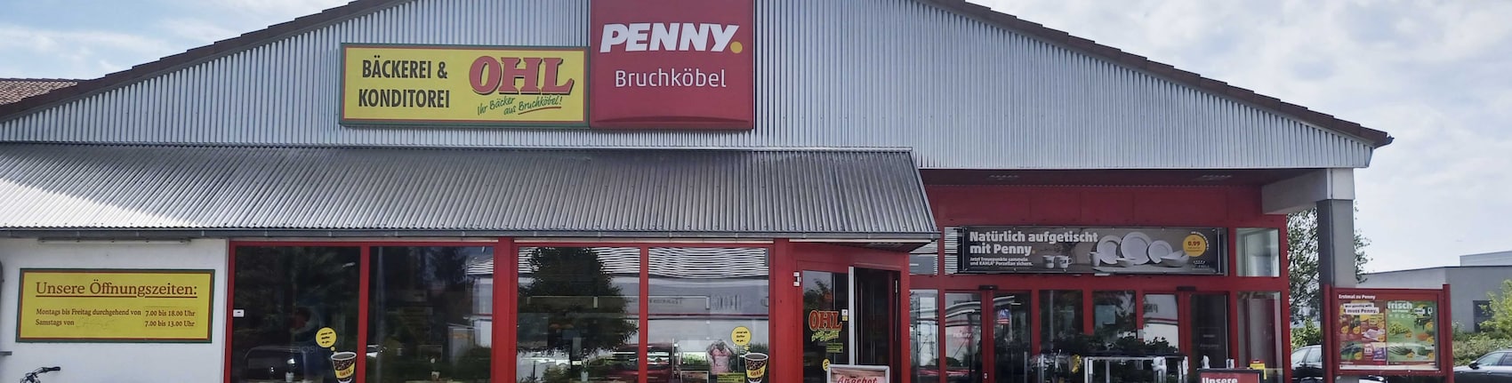 Sie sehen den Eingang vom Penny Markt in Bruchköbel Römerstr. 11,13+25