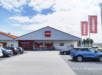 Sie sehen den Eingang vom Penny Markt in Buerstadt, Mainstr. 131