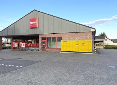 Sie sehen den Eingang vom Penny Markt in Habichtswald, Kasselerstr. 7