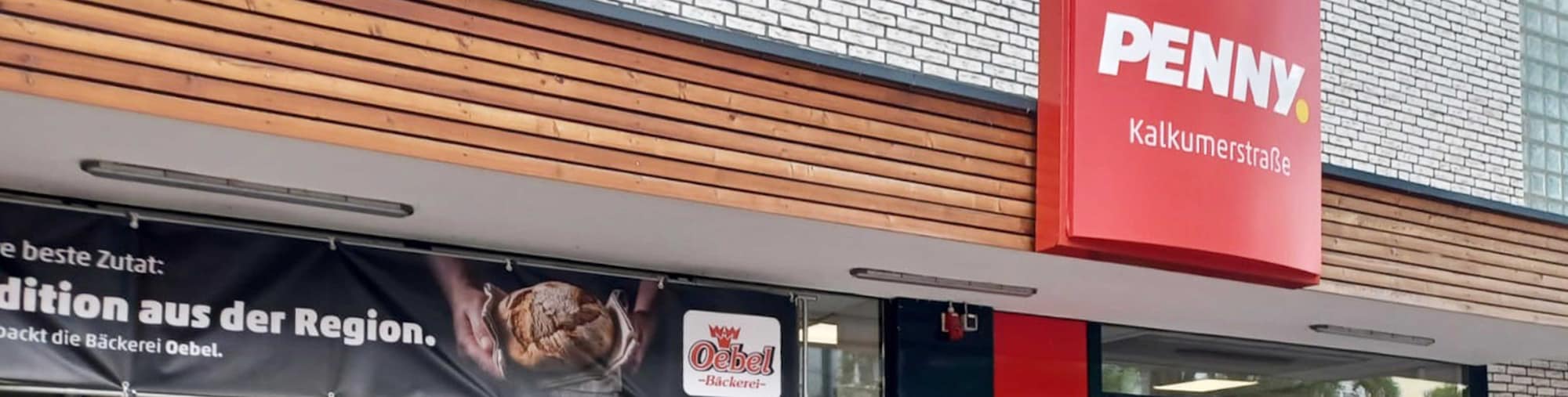 Sie sehen den Eingang vom Penny Markt Düsseldorf Kalkumer Str. 136-138
