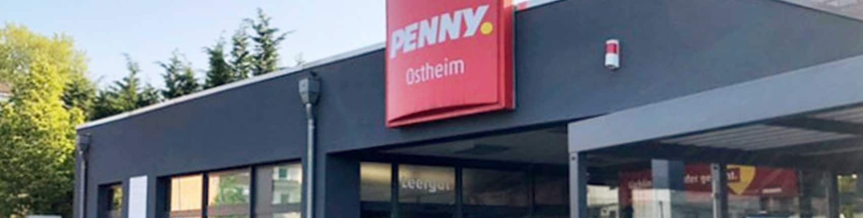 sie sehen den Eingang vom Penny Markt in Köln-Ostheim Rösrather Str.64 /Hardgenb. Kirchw.