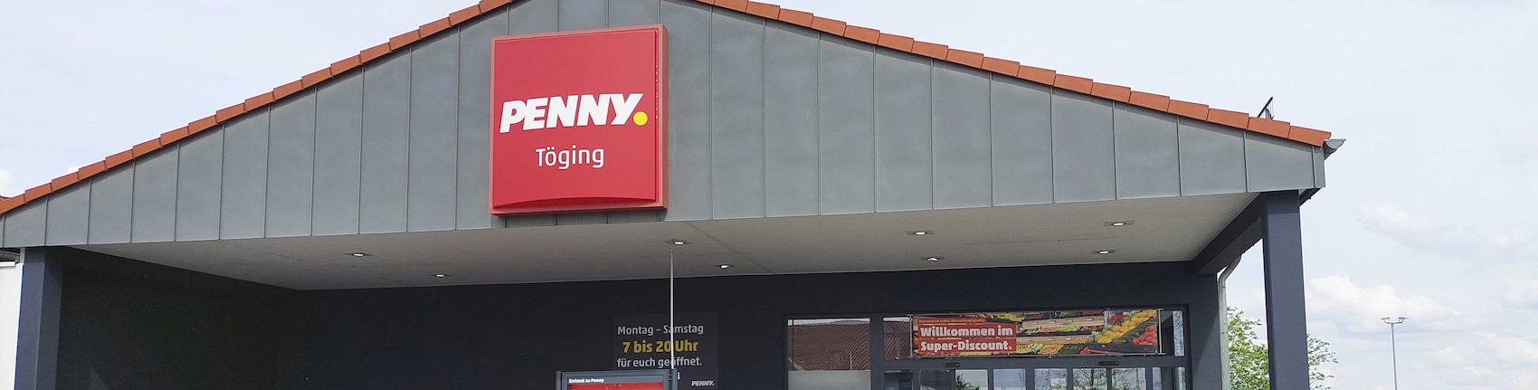 Sie sehen den Eingang vom Penny Markt in Toeging Winhoeringer Str. 23