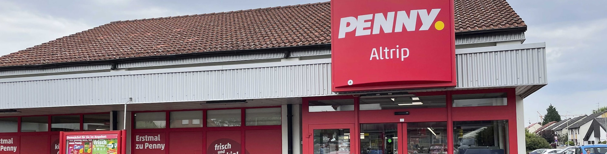 Sie sehen den Eingang vom Penny Markt in Altrip, Slevogtweg 11-17/Dalbergstr.