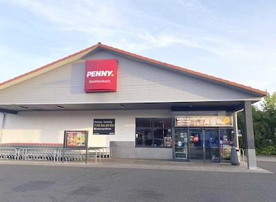 Sie sehen den Eingang vom Penny Markt in Kleinheubach In Der Seehecke 9