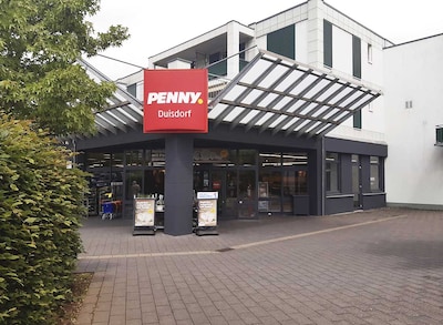 Sie sehen den Eingang vom Penny Markt in Bonn – Duisdorf Bahnhofstr. 26