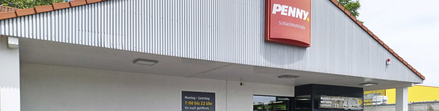 Sie sehen den Eingang vom Penny Markt Duisburg – Röttgersbach Schlachthofstr. 46