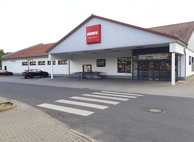 Sie sehen den Eingang vom Penny Markt in Wusterhausen OT Niederlehme Karl-Marx-Str. 170