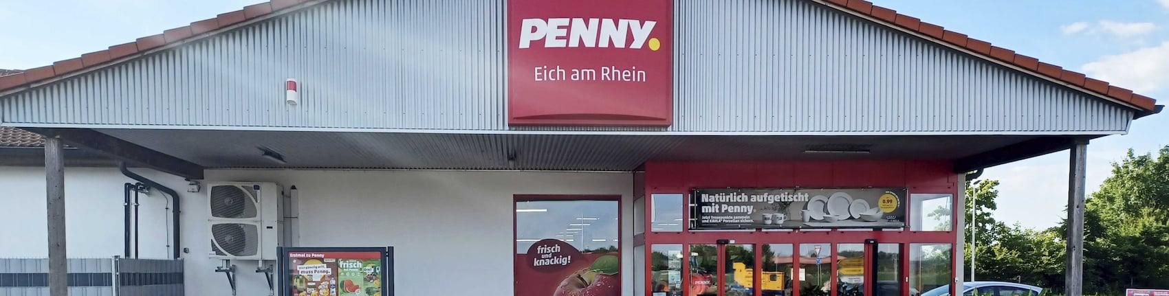 Sie sehen den Eingang vom Penny Markt in Eich, Osthofener Str. 110