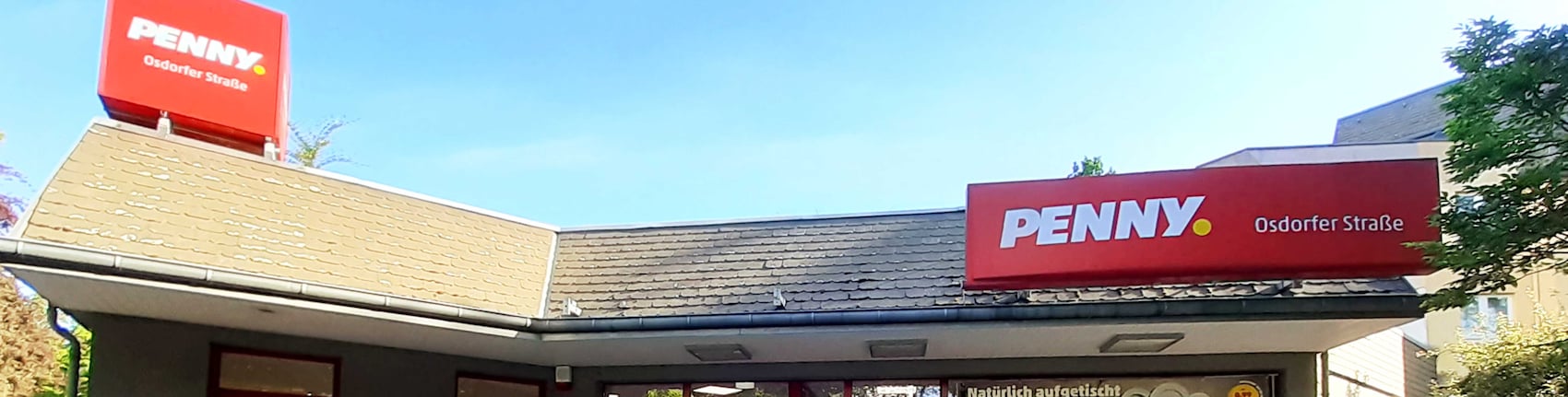 Sie sehen den Eingang vom Penny Markt in Berlin/Lichterfelde Osdorfer Str. 98