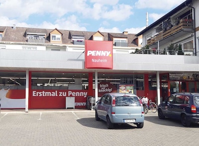 Sie sehen den Eingang vom Penny Markt in Nauheim, Am Schafsteg 1-7