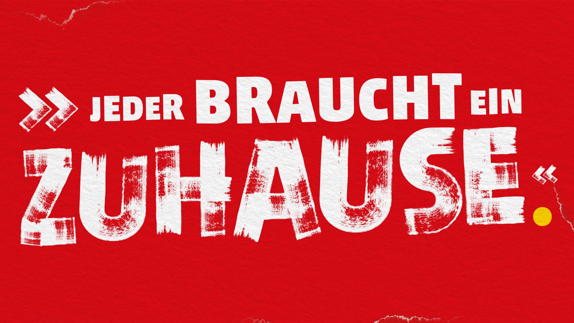 Ein Zitat in weißer Schrift auf rotem Hintergrund: Jeder braucht ein Zuhause.