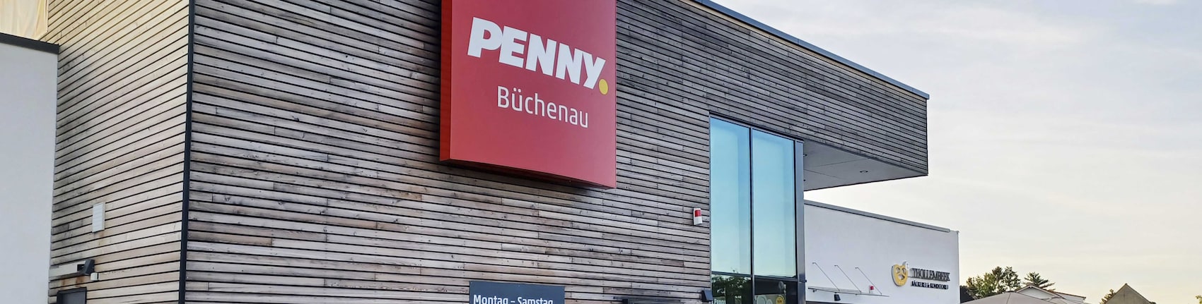 Sie sehen den Eingang vom Penny Markt in Bruchsal – Büchenau, Neutharder Str. 7