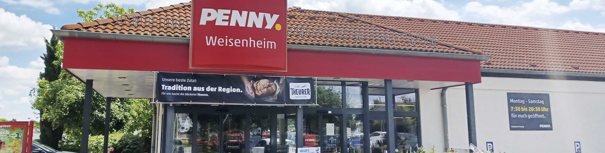 Sie sehen den Eingang vom Penny Markt in Weisenheim Am Sand, Almenweg 4