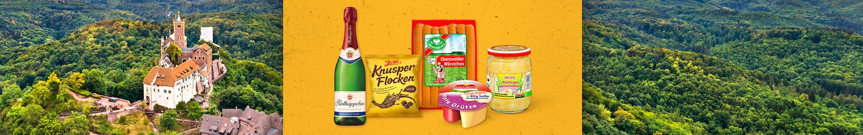 Eine Range mit regionalen Produkten aus dem schönen Südwesten zum Beispiel Apfelmus, Gerolsteiner Wasser oder Käse Knacker, vor einer Fluß-Landschaft im Südwesten. 
