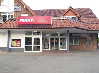 Sie sehen den Eingang vom Penny Markt in Huellhorst, Hauptstr. 3