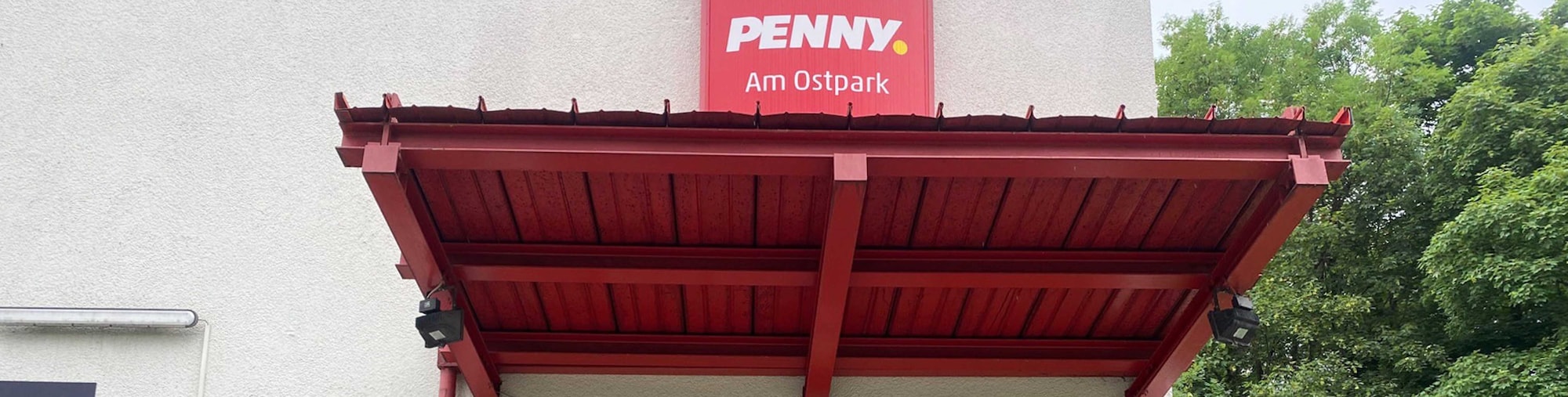 Sie sehen den Eingang vom Penny Markt in Muenchen/Ramersd.-Perlach, Quiddestr. 58