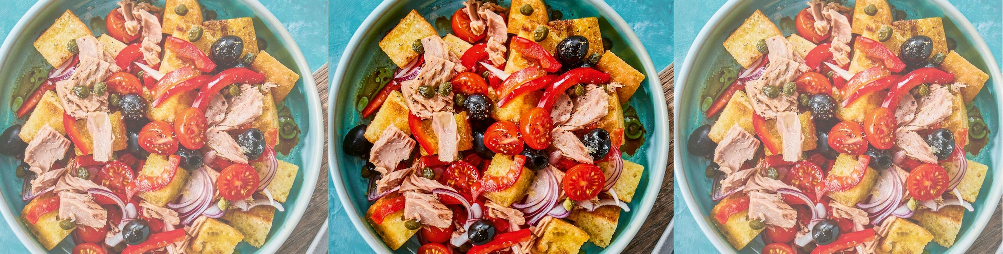 Dieses Bild zeigt die fertigen Panzanella al tonno mit Oliven und Tomaten.