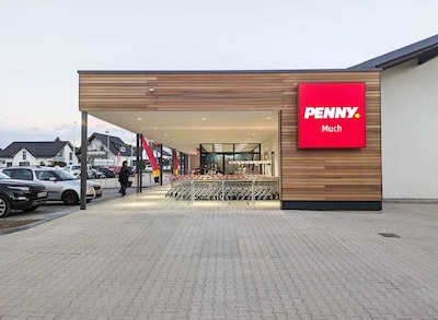 Sie sehen den Eingang vom Penny Markt in Much Krahmer Weg  1