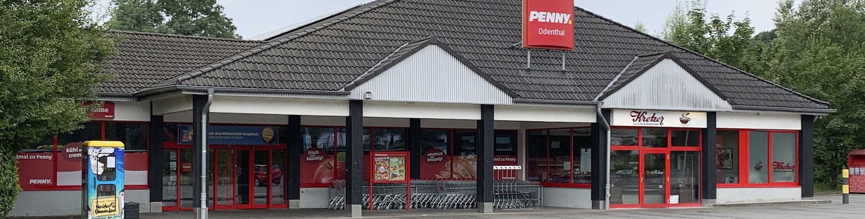 Sie sehen den Eingang vom Penny Markt in Odenthal – Osenau, In Der Hofer Aue 1