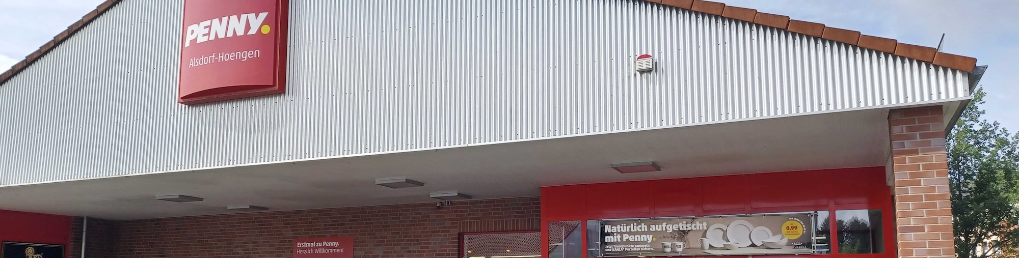 Sie sehen den Eingang vom Penny Markt in Alsdorf Juelicher Strasse 186