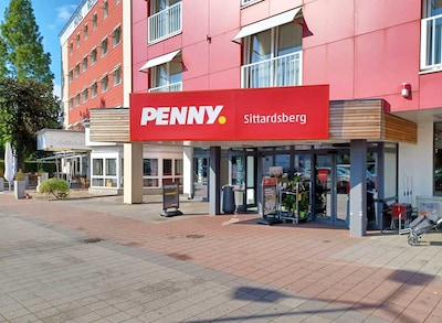 Sie sehen den Eingang vom Penny Markt Duisburg – Buchholz Sittardsberger Allee 10