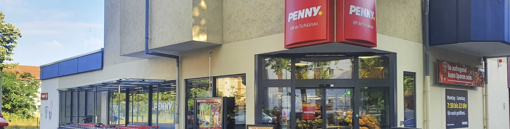 Sie sehen den Eingang vom Penny Markt in Mannheim/Schoenau, Johann-Schuette-Str. 7-11