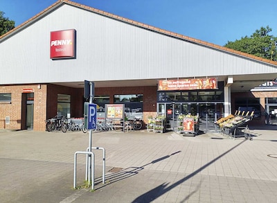 Sie sehen den Eingang vom Penny Markt in Tostedt, Bahnhofstr. 36