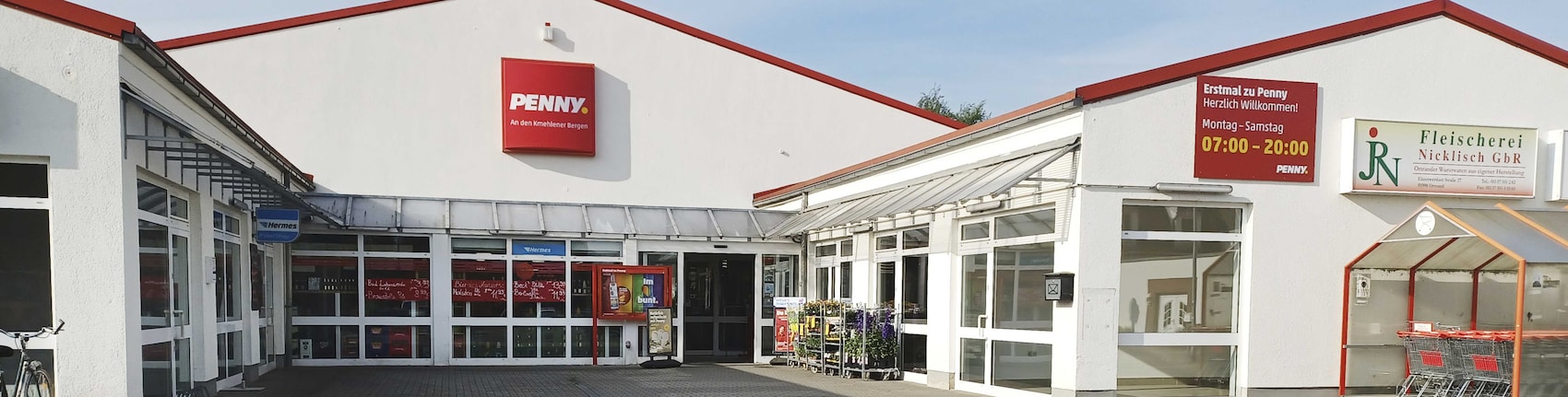 Sie sehen den Eingang vom Penny Markt in Ortrand Elsterwerdaer Str. 25A