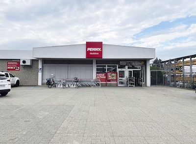 Sie sehen den Eingang vom Penny Markt in Heddesheim, Edekastr. 8