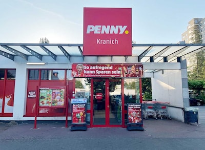 Sie sehen den Eingang vom Penny Markt in Darmstadt/Kranichstein, Grundstr. 10 -12