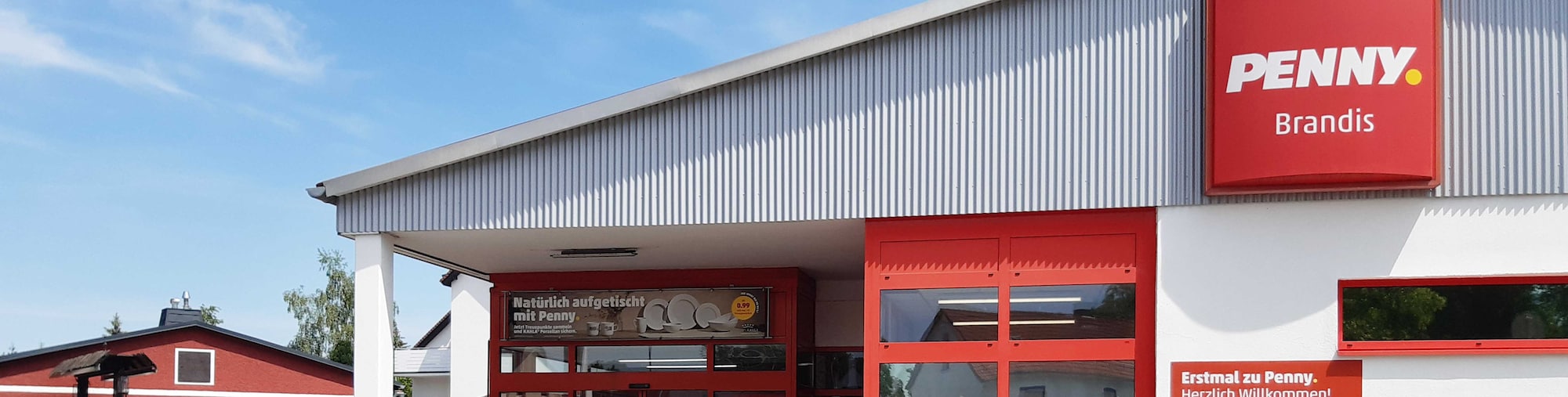 Sie sehen den Eingang vom Penny Markt in Brandis Wurzener Straße 1