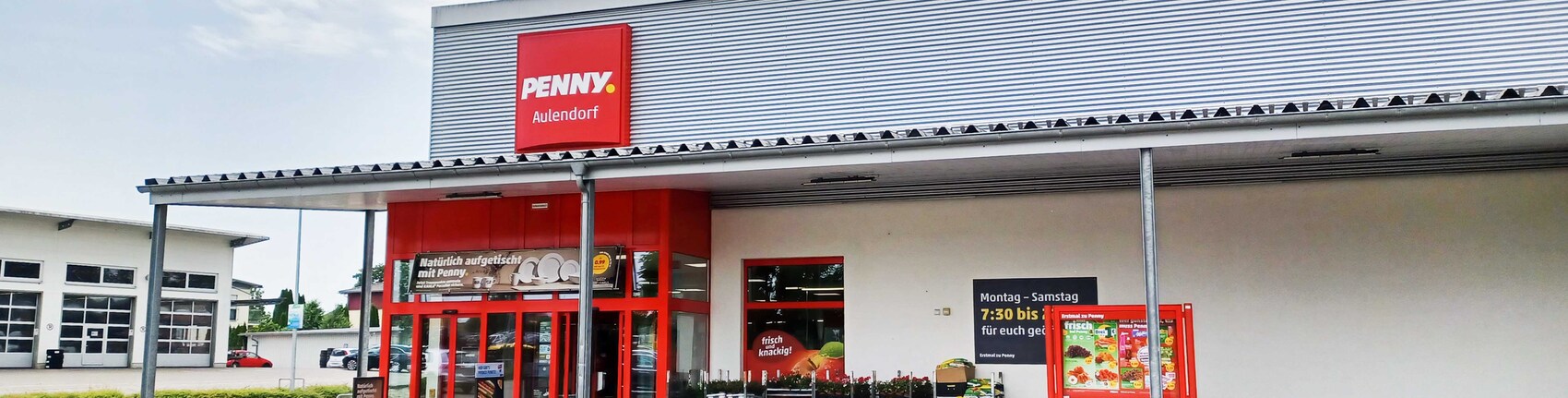 Sie sehen den Eingang vom Penny Markt in Aulendorf Alte Kiesgrube 3
