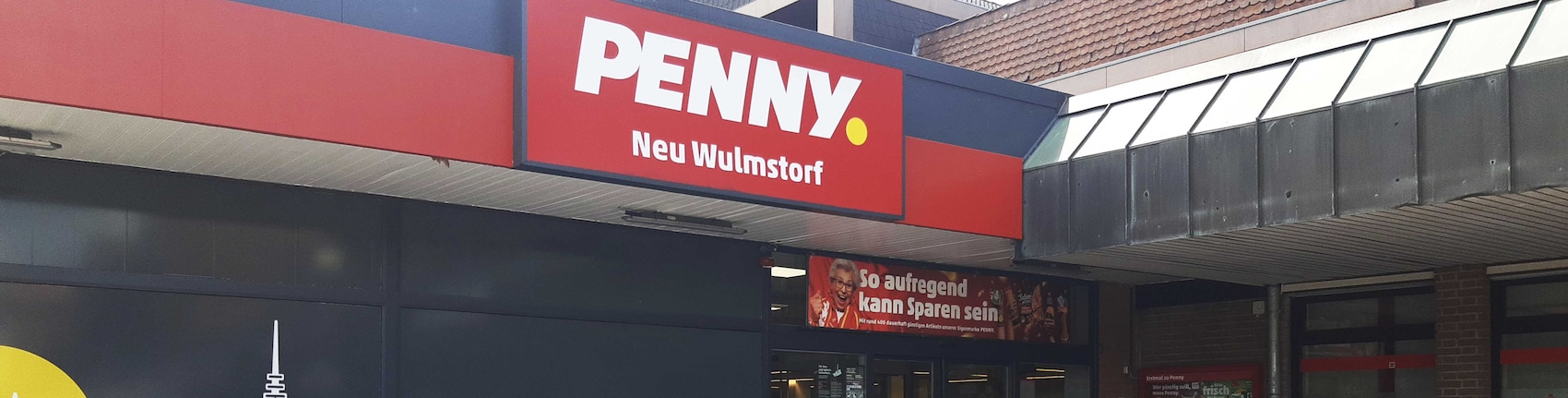 Sie sehen den Eingang vom Penny Markt in Neu Wulmstorf, Bahnhofstr. 19