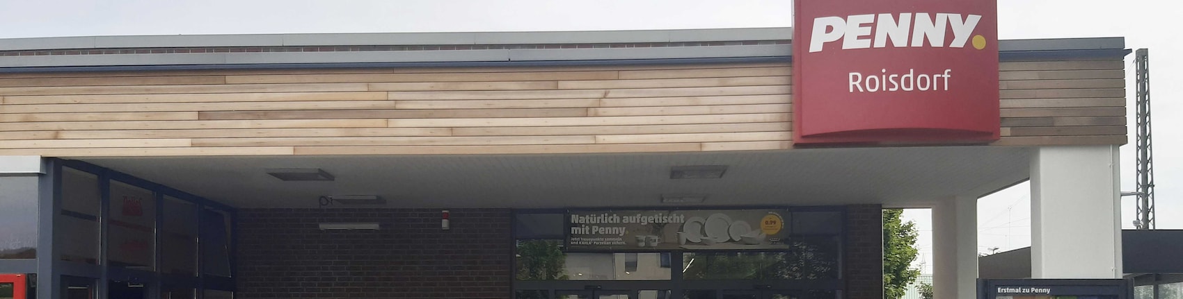 Sie sehen den Eingang vom Penny Markt in Bornheim – Roisdorf Bonner Str. 22