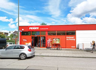 Sie sehen den Eingang vom Penny Markt in Muenchen/Solln Kandinskystr. 16
