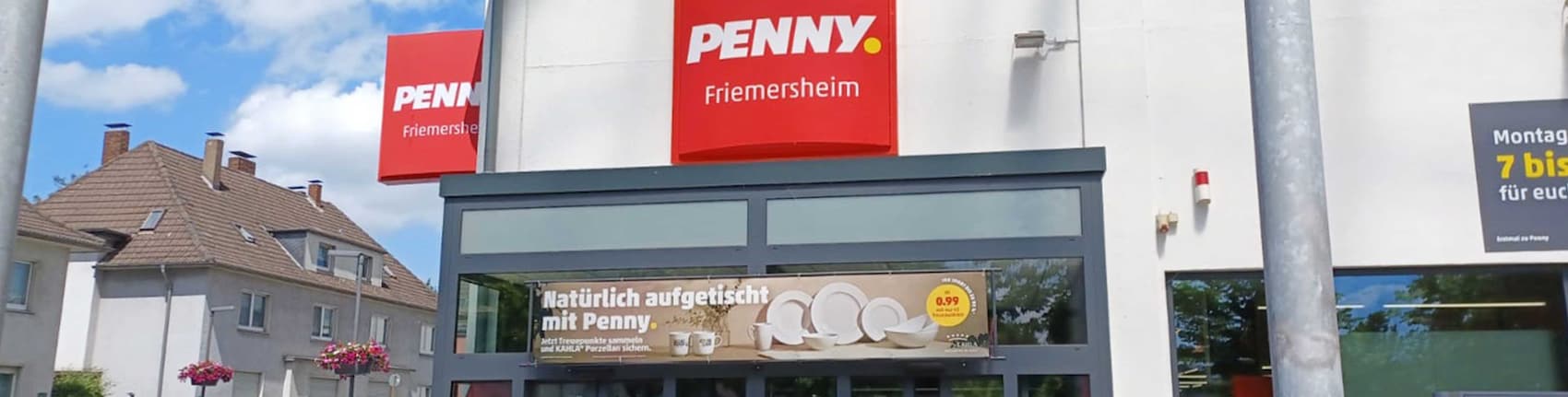 Sie sehen den Eingang vom Penny Markt Duisburg – Friemersheim Kaiserstr. 12/Am Markt