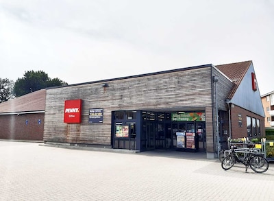 Sie sehen den Eingang vom Penny Markt in Trittau, Zum Riden 3