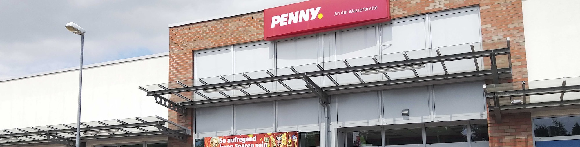 Sie sehen den Eingang vom Penny Markt in Buende, Wasserbreite 25