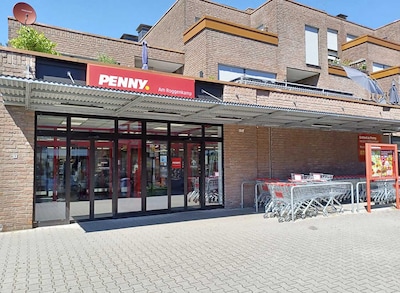 Sie sehen den Eingang vom Penny Markt in Münster - Hiltrup, Am Roggenkamp 188-192